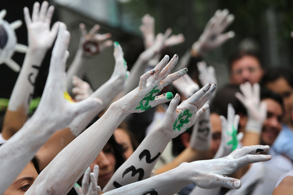 Student protesters stage a demonstration front of Mexico's Federal Election Commission on Tuesday in Mexico City.