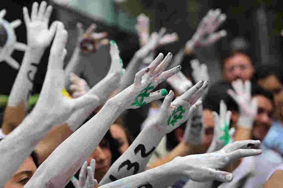 Student protesters stage a demonstration front of Mexico's Federal Election Commission on Tuesday in Mexico City.