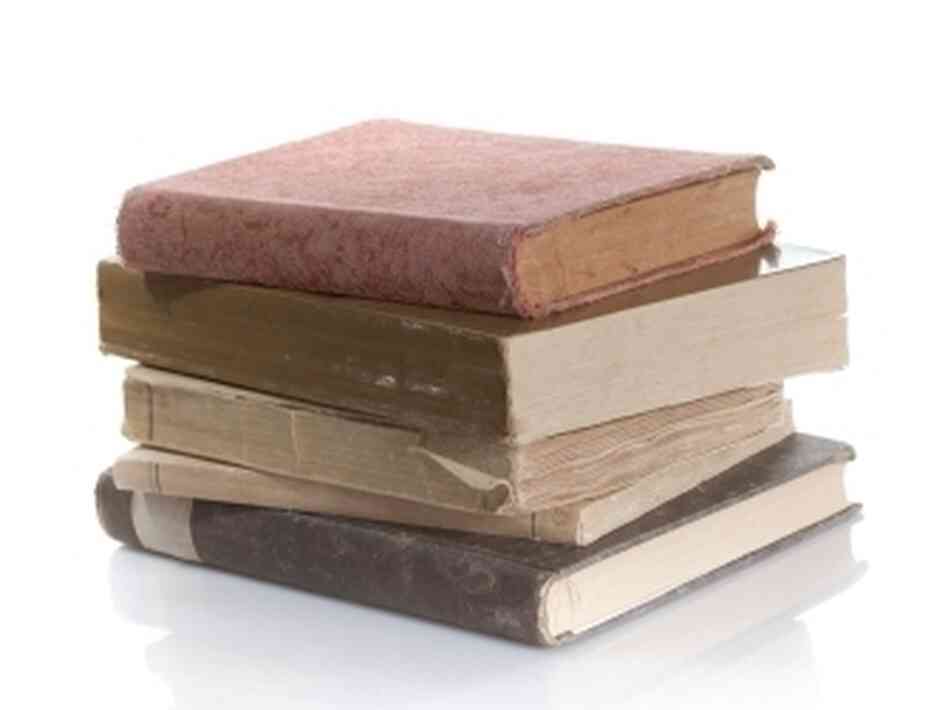 Books sit in a stack. Books sit in a stack.