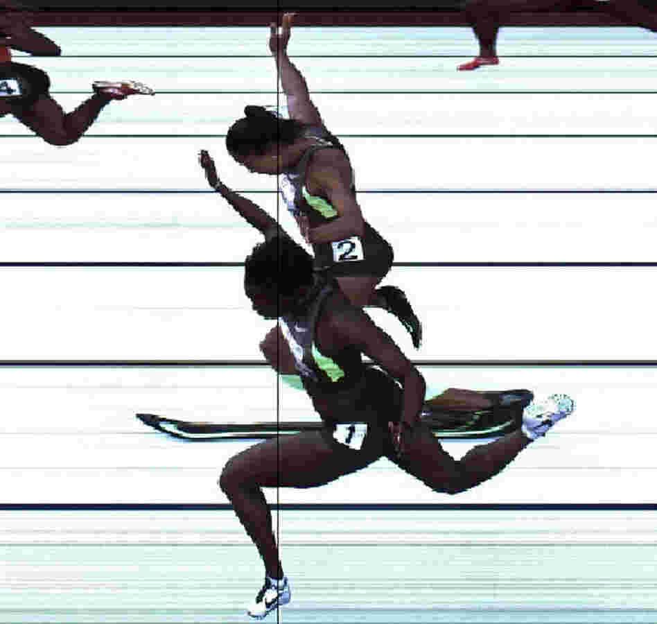 In this handout photo provided by the USATF, Jeneba Tarmoh (bottom, lane 1) and Allyson Felix cross the finish line at exactly the same time in the women's 100 meter dash final during Day Two of the 2012 U.S. Olympic Track & Field Team Trials at Hayward Field on Saturday in Eugene, Ore. It's their torsos, not head, hands, feet or arms, that matter.