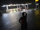 Convenience store employee Lindsey Bennight watched floodwaters surround the store where she works in Crawfordville, Fla., on Monday (June 25, 2012). Convenience store employee Lindsey Bennight watched floodwaters surround the store where she works in Crawfordville, Fla., on Monday (June 25, 2012).