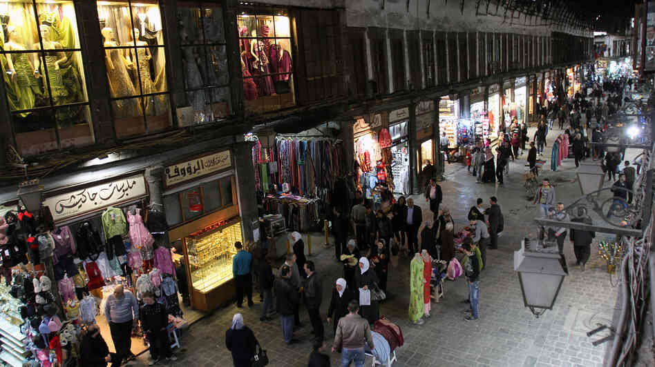 People walk through Hamidiyah market in Damascus, Syria, Feb. 28. The merchants of this landmark bazaar were once ardent supporters of President Bashar Assad. That's no longer the case.