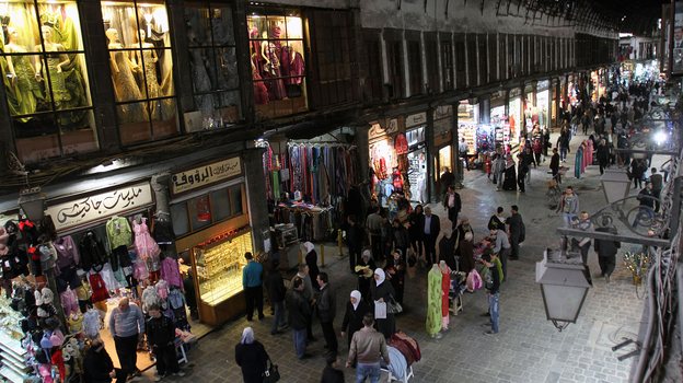 People walk through Hamidiyah market in Damascus, Syria, Feb. 28. The merchants of this landmark bazaar were once ardent supporters of President Bashar Assad. That's no longer the case. People walk through Hamidiyah market in Damascus, Syria, Feb. 28. The merchants of this landmark bazaar were once ardent supporters of President Bashar Assad. That's no longer the case.