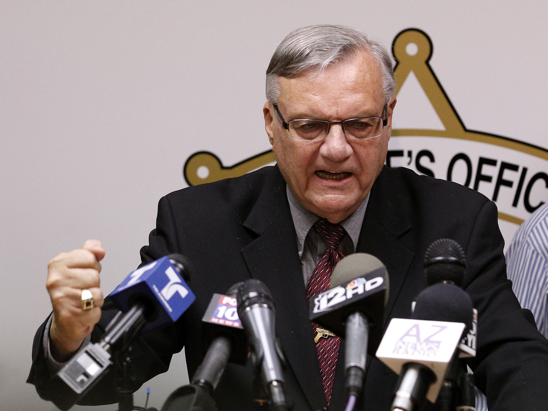 A defiant Maricopa County Sheriff Joe Arpaio answers questions about the Justice Department's lawsuit against him during a news conference in Phoenix last month.
