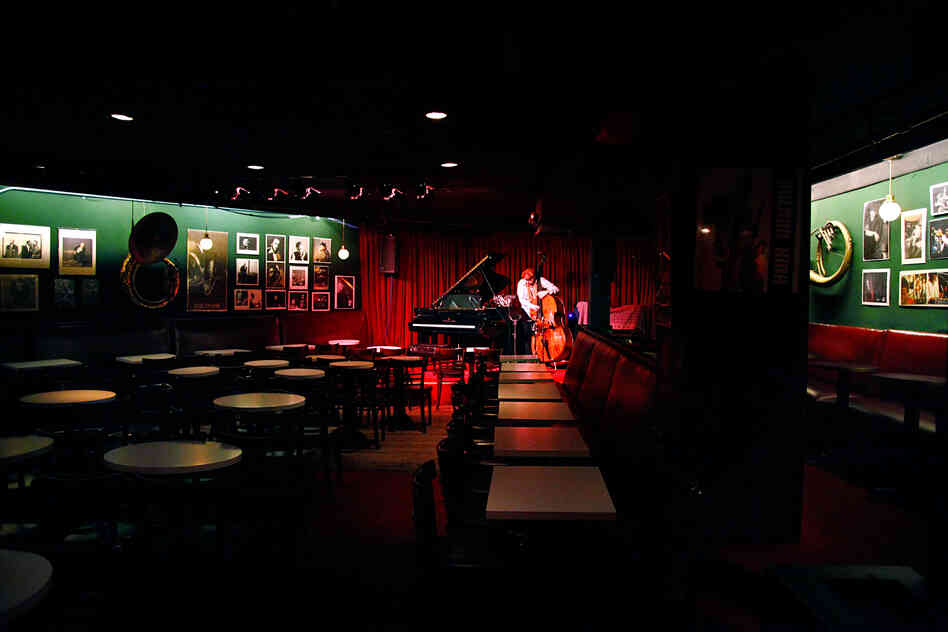 Protected from the glare of sunlight, the little wedge-shaped room is peaceful in the afternoon. Musicians will sometimes come to practice here, among the spirits of jazz past, before their performances in the evening.