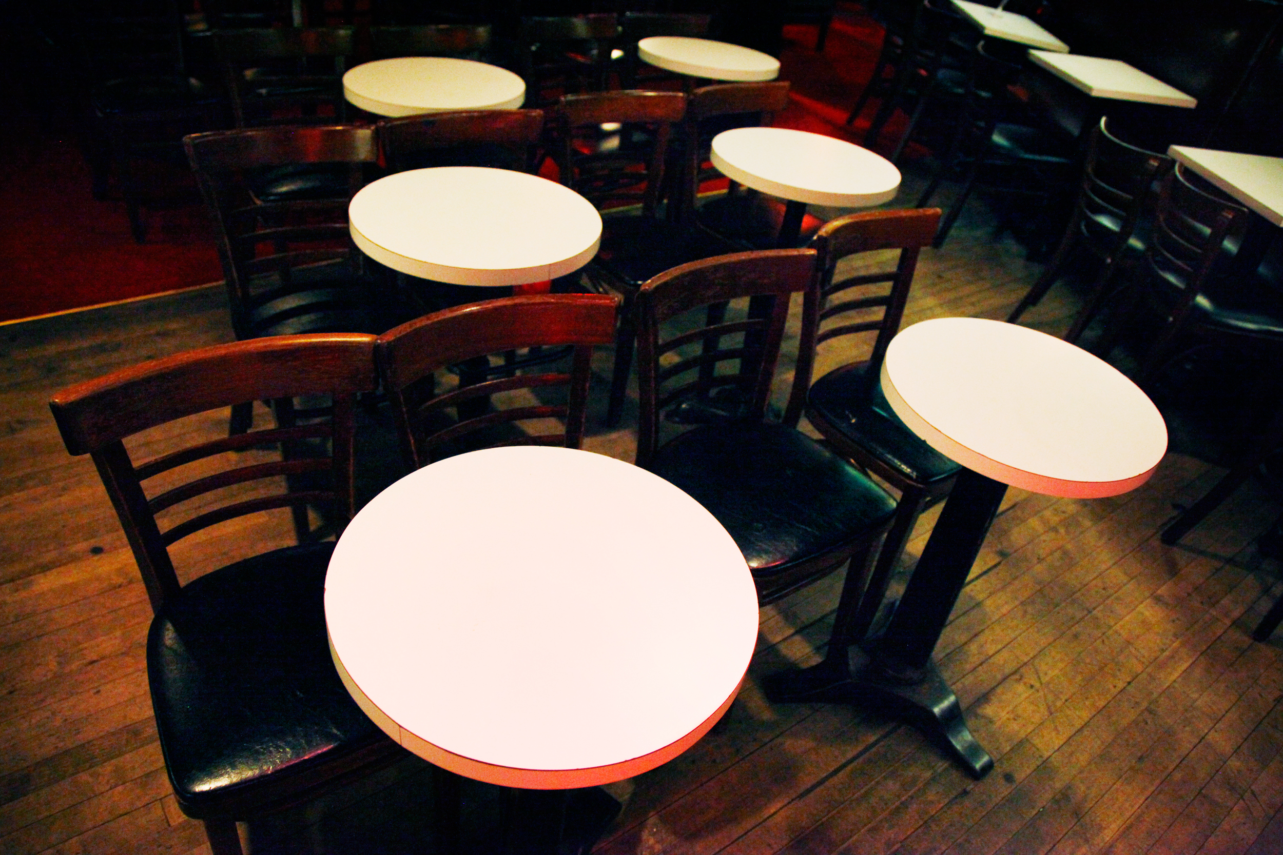 In the interest of accommodating lots of people, tables and chairs should take up as little real estate as humanly possible.