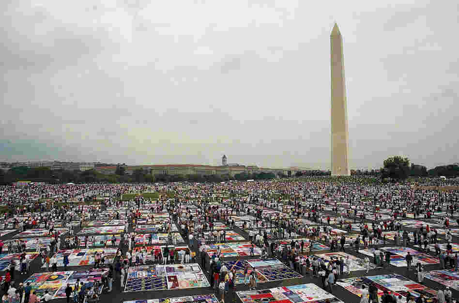 Thousands of people examine the individual panels of the AIDS Memorial Quilt as it is displayed in Washington in 1992.