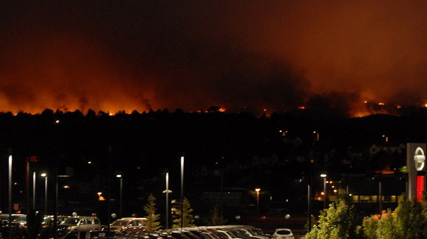 Flames from the Waldo Canyon Fire glowed on the western side of Colorado Springs, Colo., Tuesday night.