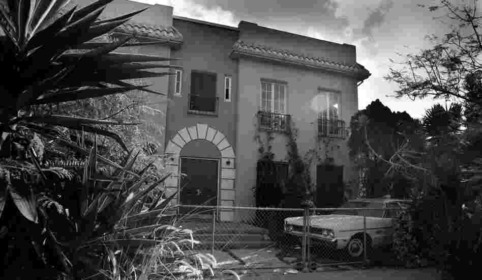 "I look at a bleak fortress like this house, with its chain-link fence and fenced-in beat-up car and I wonder, 'What goes on in here? What has gone on in here? And what will go on in here?' "