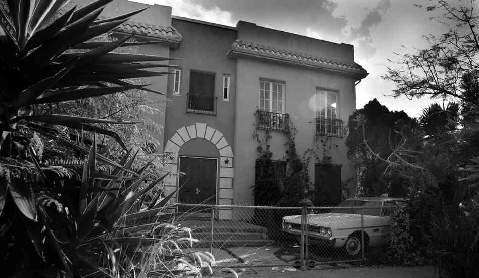 "I look at a bleak fortress like this house, with its chain-link fence and fenced-in beat-up car and I wonder, 'What goes on in here? What has gone on in here? And what will go on in here?' "