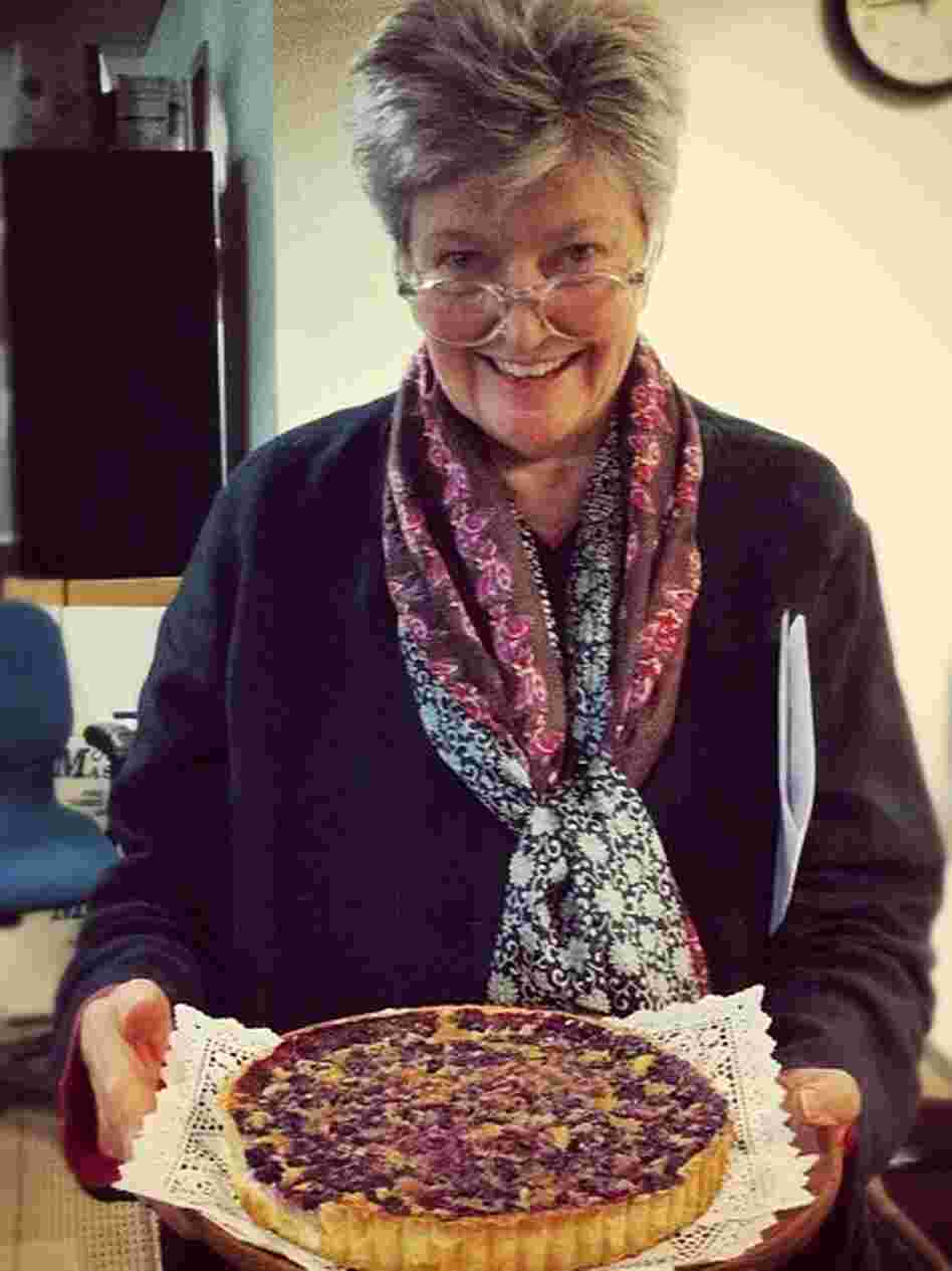 Linda Wertheimer shows off her chess pie with blueberries at the NPR headquarters pie contest.