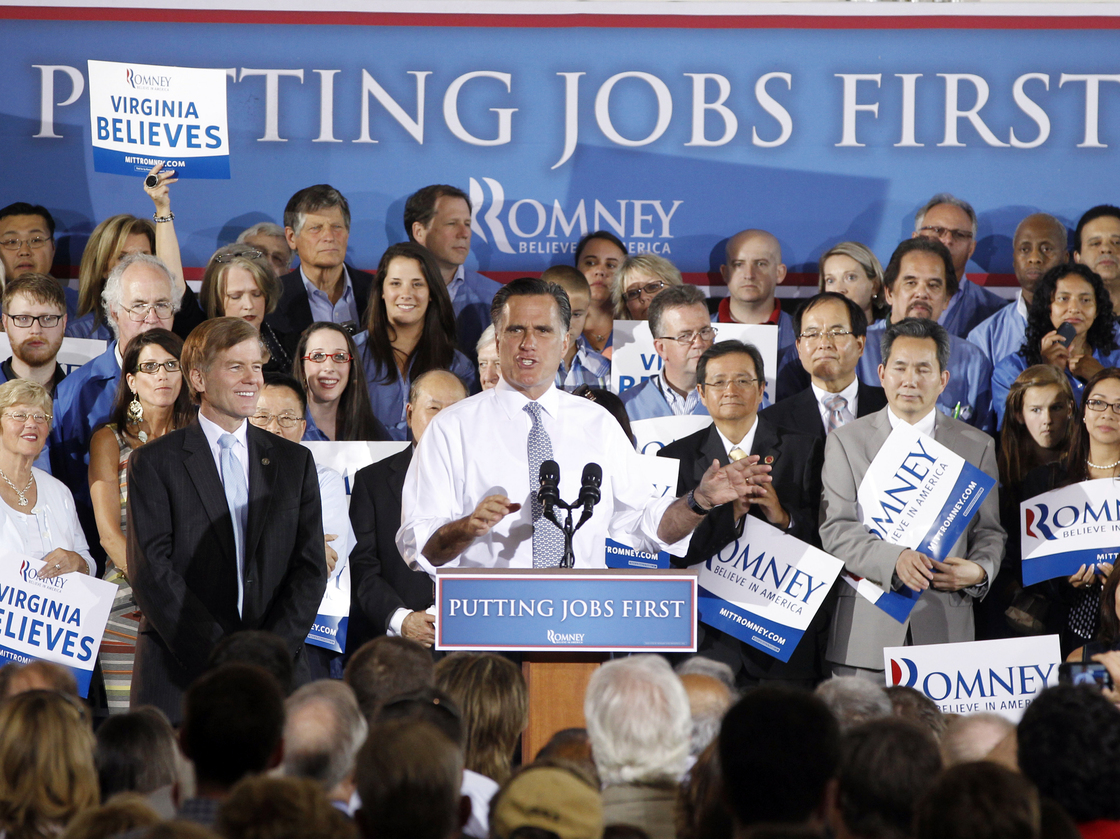 Mitt Romney appears with Virginia Gov. Bob McDonnell (left) on Wednesday. Romney failed to convince Washington Post journalists they were wrong to link him to the outsourcing of U.S. jobs while he led Bain Capital.