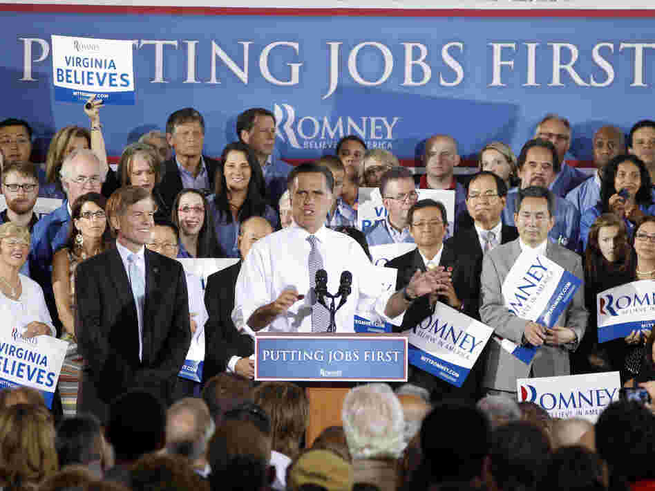 Mitt Romney appears with Virginia Gov. Bob McDonnell (left) on Wednesday. Romney failed to convince Washington Post journalists they were wrong to link him to the outsourcing of U.S. jobs while he led Bain Capital.
