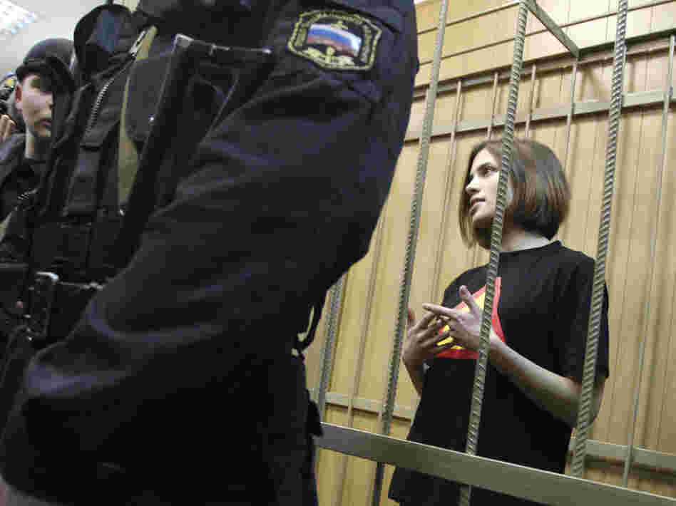 Nadezhda Tolokonnikova is one of three women jailed in connection with the protest. They have been charged with hooliganism and could receive up to seven years in prison. She is shown here in a defendant's cage before a court hearing in Moscow in April.