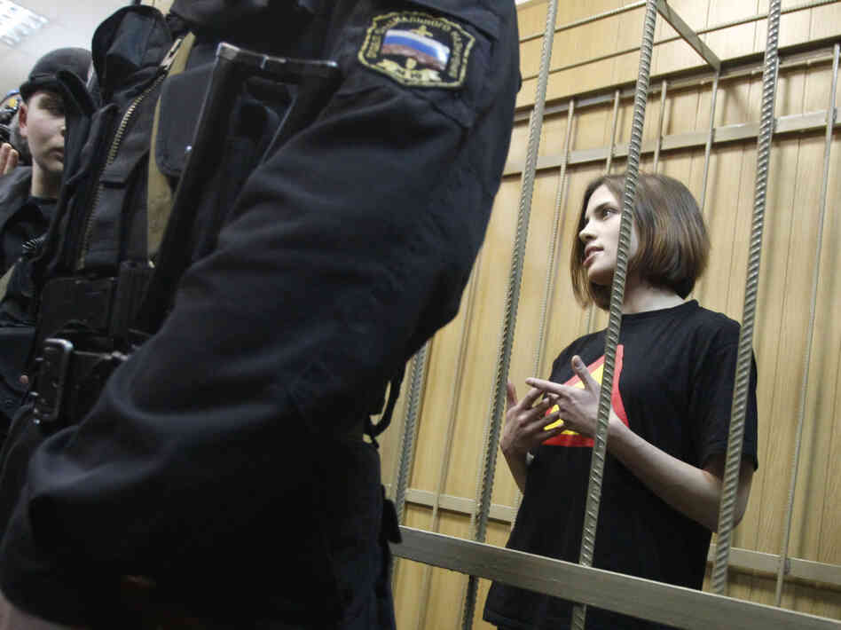 Nadezhda Tolokonnikova is one of three women jailed in connection with the protest. They have been charged with hooliganism and could receive up to seven years in prison. She is shown here in a defendant's cage before a court hearing in Moscow in April.