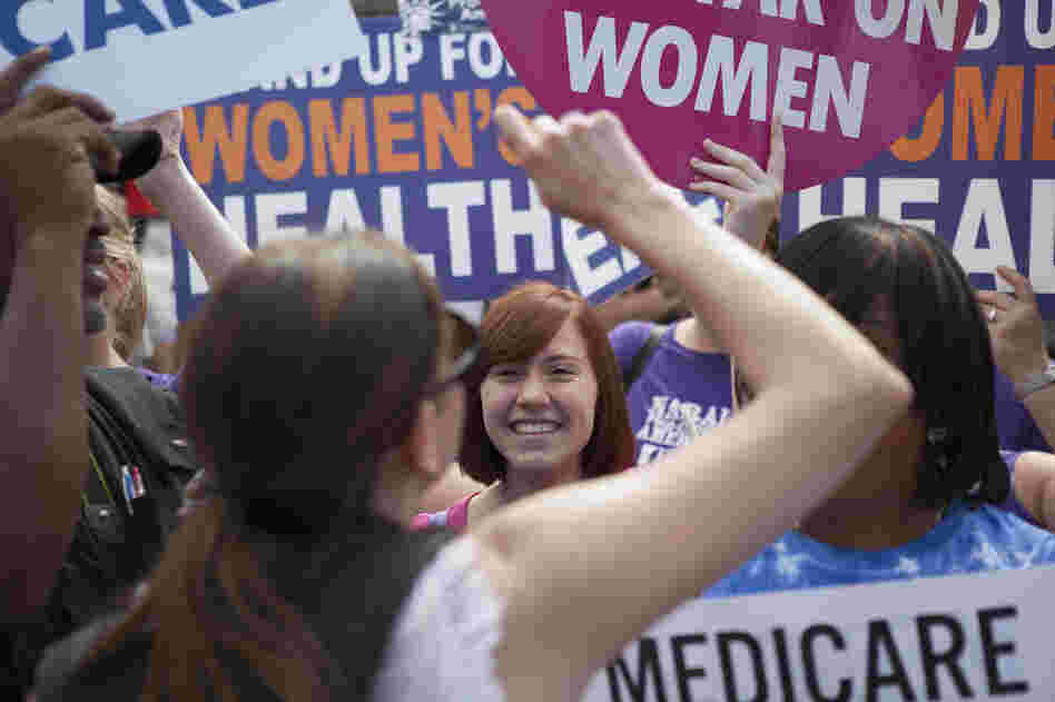 Supporters of President Obama's Affordable Care Act celebrate outside the Supreme Court. Across from the celebration, protesters voiced their opposition to the court's ruling.