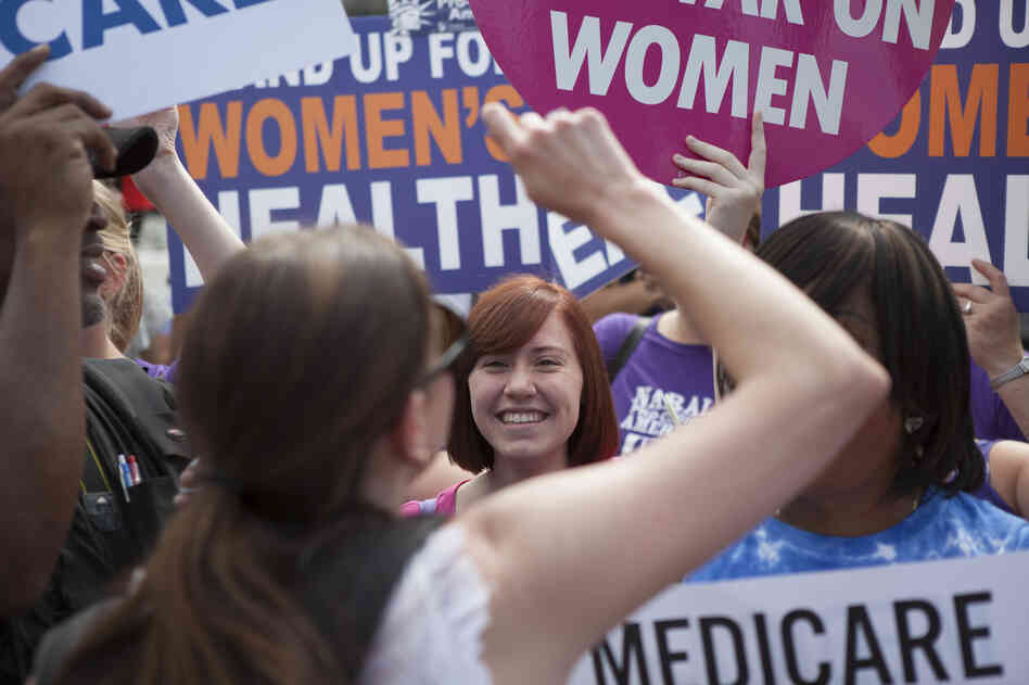 Supporters of President Obama's Affordable Care Act celebrate outside the Supreme Court. Across from the celebration, protesters voiced their opposition to the court's ruling.