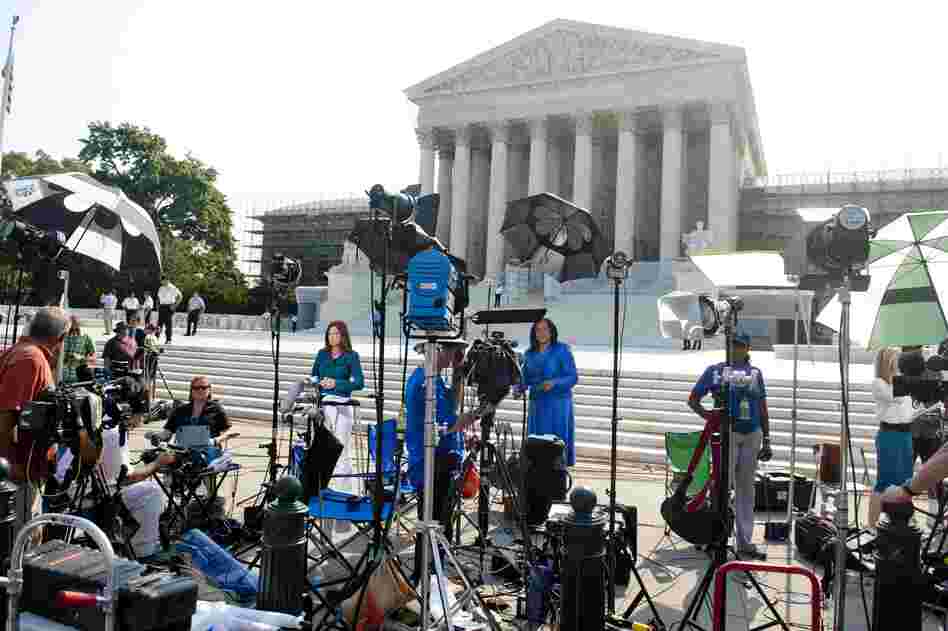Journalists await the court's decision on the constitutionality of the Affordable Care Act, President Obama's signature legislation.
