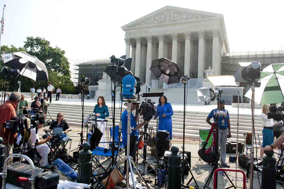 Journalists await the court's decision on the constitutionality of the Affordable Care Act, President Obama's signature legislation.
