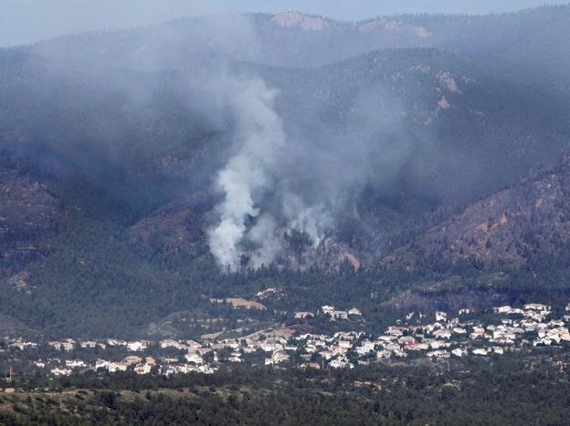 Smoke was rising earlier today from the Waldo Canyon wildfire that's threatening Colorado Springs, Colo.