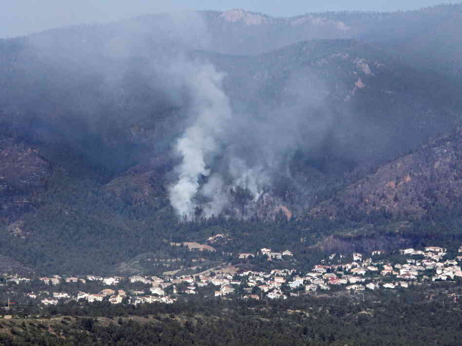 Smoke was rising earlier today from the Waldo Canyon wildfire that's threatening Colorado Springs, Colo.