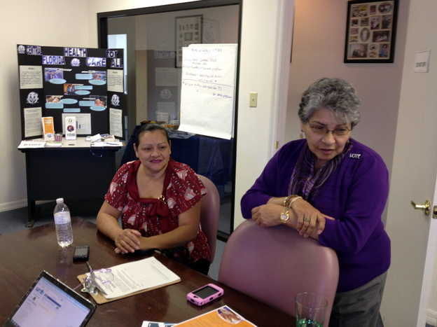 Josephine Mercado (right) with Brenda Serrano at the Hispanic Health Initiatives office in Casselberry, Fla. Mercado says she plans a party now that the Supreme Court has ruled on the health law.