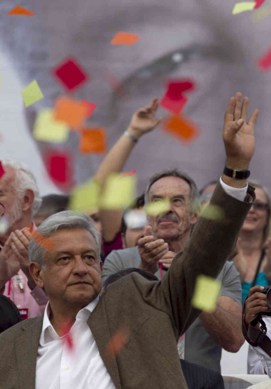 Andres Manuel Lopez Obrador, presidential candidate for the Democratic Revolution Party, waves at supporters during the closing rally of his campaign at the main Zocalo plaza in Mexico City on Wednesday.