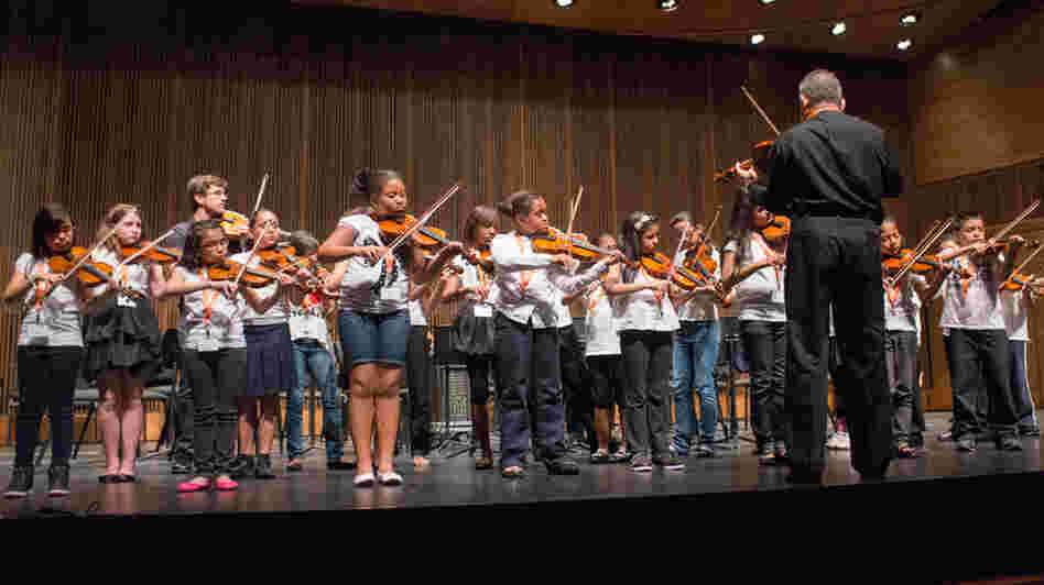Nathan Schram (back row, third from left) performs with his students from PS 75 in Brooklyn.