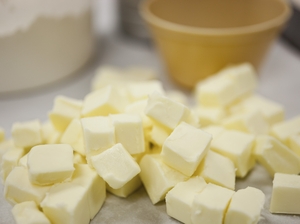 Cut the butter into one-half inch chunks. Add water and mix by hand.