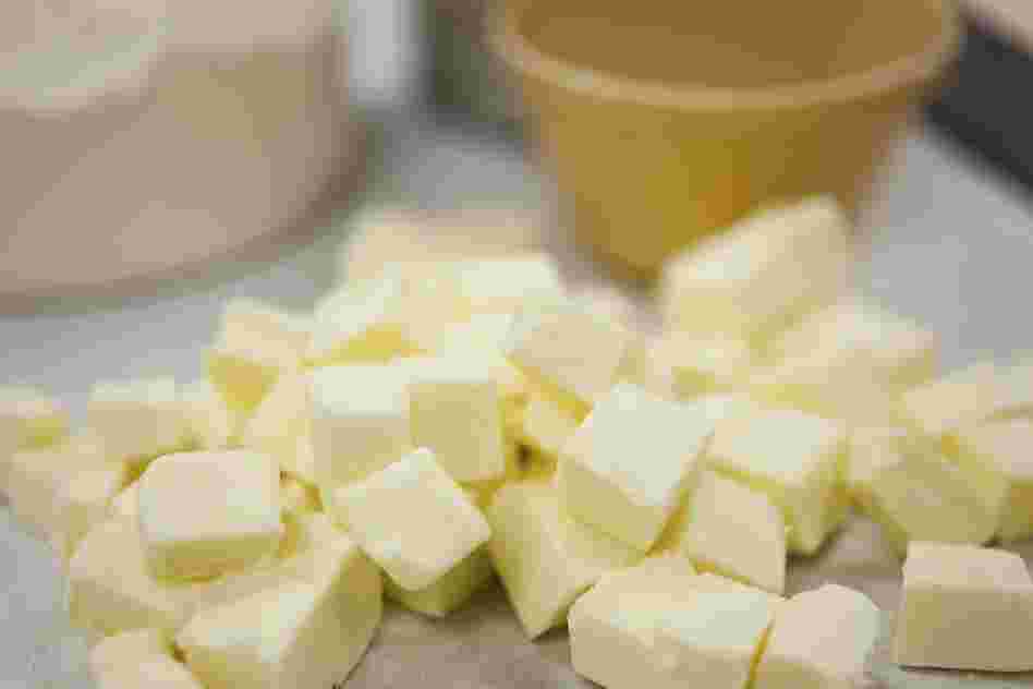 Cut the butter into one-half inch chunks. Add water and mix by hand.