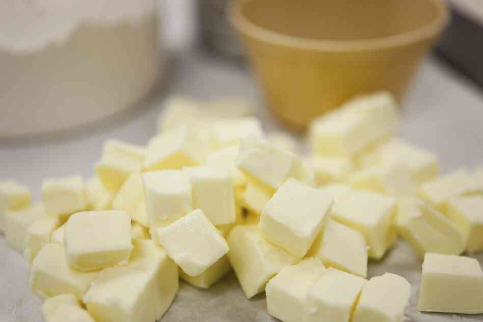 Cut the butter into one-half inch chunks. Add water and mix by hand.