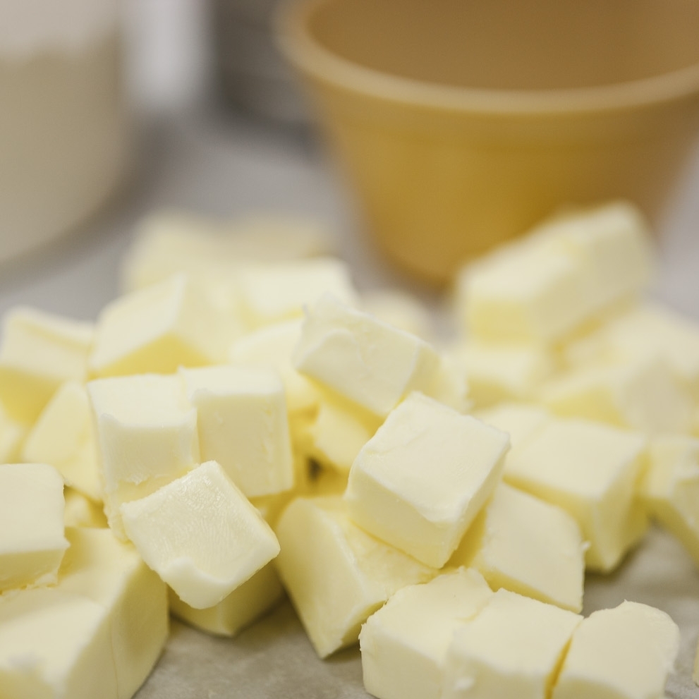 Cut the butter into one-half inch chunks. Add water and mix by hand.