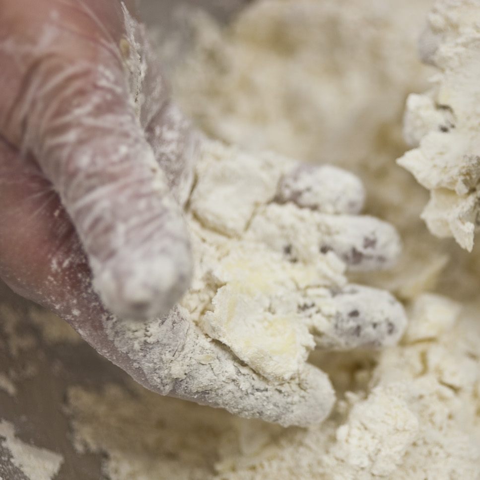 Flake the butter chunks into the flour. The chunks should still be visible.