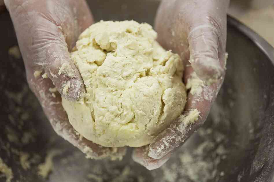 "Do not overwork the dough," says Chef Higgins. You want a loose, jaggedy ball.
