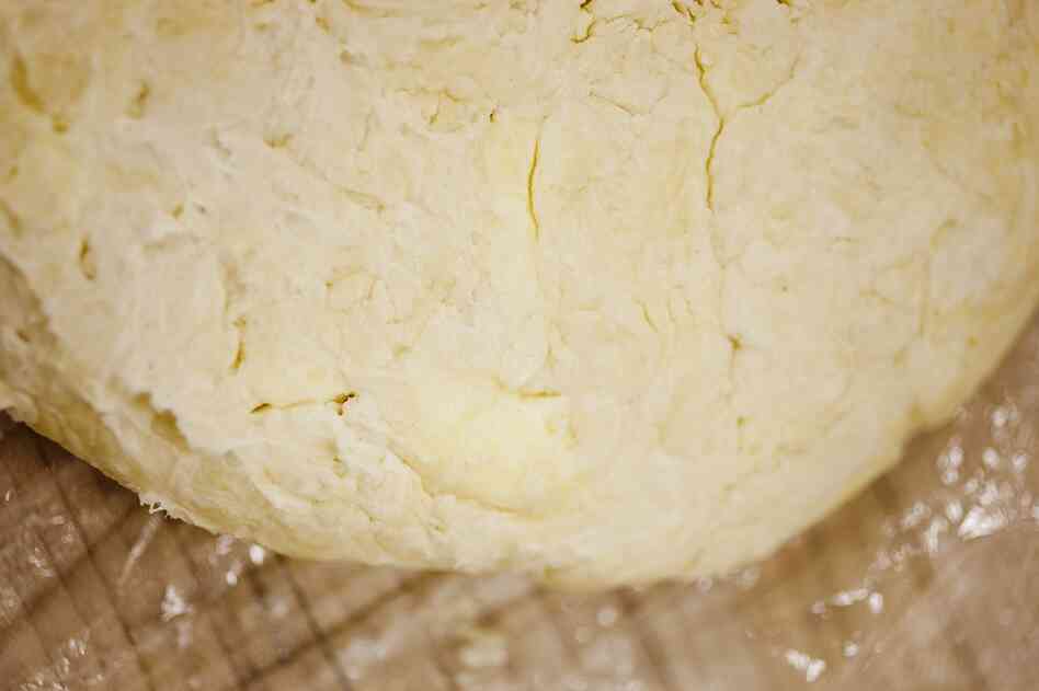 Press ball gently into a disk, refrigerate in plastic for an hour or so before rolling.