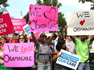 Supporters of President Obama's health care overhaul, cheer outside of the Supreme Court on Thursday, after the court upheld a majority of the law. Supporters of President Obama's health care overhaul, cheer outside of the Supreme Court on Thursday, after the court upheld a majority of the law.