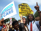 Kailash Sundaran (left), Devyn Greenberg and Devontae Freeland celebrate the Supreme Court's ruling upholding the Affordable Health Care Act outside the court Thursday. Kailash Sundaran (left), Devyn Greenberg and Devontae Freeland celebrate the Supreme Court's ruling upholding the Affordable Health Care Act outside the court Thursday.