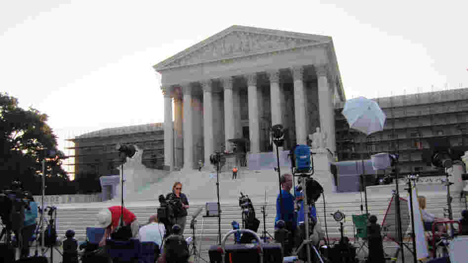 The scene outside the U.S. Supreme Court this morning: lights, camera and soon action.