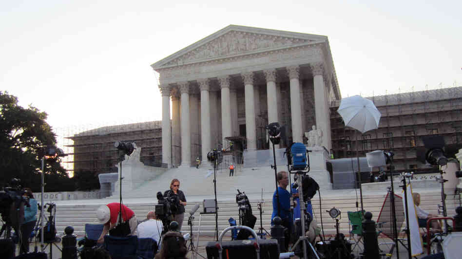 The scene outside the U.S. Supreme Court this morning: lights, camera and soon action.