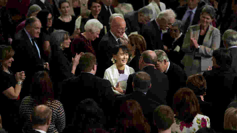 Myanmar opposition leader Aung San Suu Kyi smiles as she leaves Westminster Hall after addressing both Houses of Parliament on June 21 in London. Myanmar opposition leader Aung San Suu Kyi smiles as she leaves Westminster Hall after addressing both Houses of Parliament on June 21 in London.