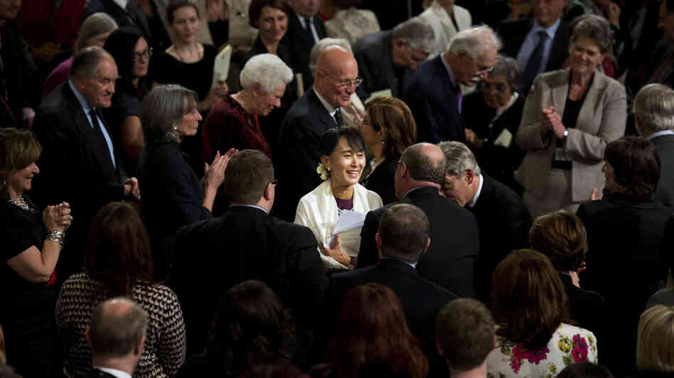 Myanmar opposition leader Aung San Suu Kyi smiles as she leaves Westminster Hall after addressing both Houses of Parliament on June 21 in London. Myanmar opposition leader Aung San Suu Kyi smiles as she leaves Westminster Hall after addressing both Houses of Parliament on June 21 in London.