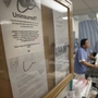 A bulletin board in New York's Jamaica Hospital offers advice for uninsured patients. A bulletin board in New York's Jamaica Hospital offers advice for uninsured patients.