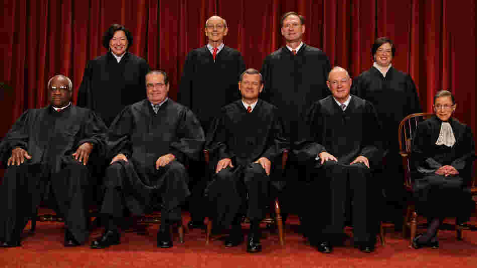 The U.S. Supreme Court justices — (first row, from left) Clarence Thomas, Antonin Scalia, Chief Justice John Roberts, Anthony Kennedy, Ruth Bader Ginsburg, (back row) Sonia Sotomayor, Stephen Breyer, Samuel Alito and Elena Kagan — pose at the Supreme Court in 2010.