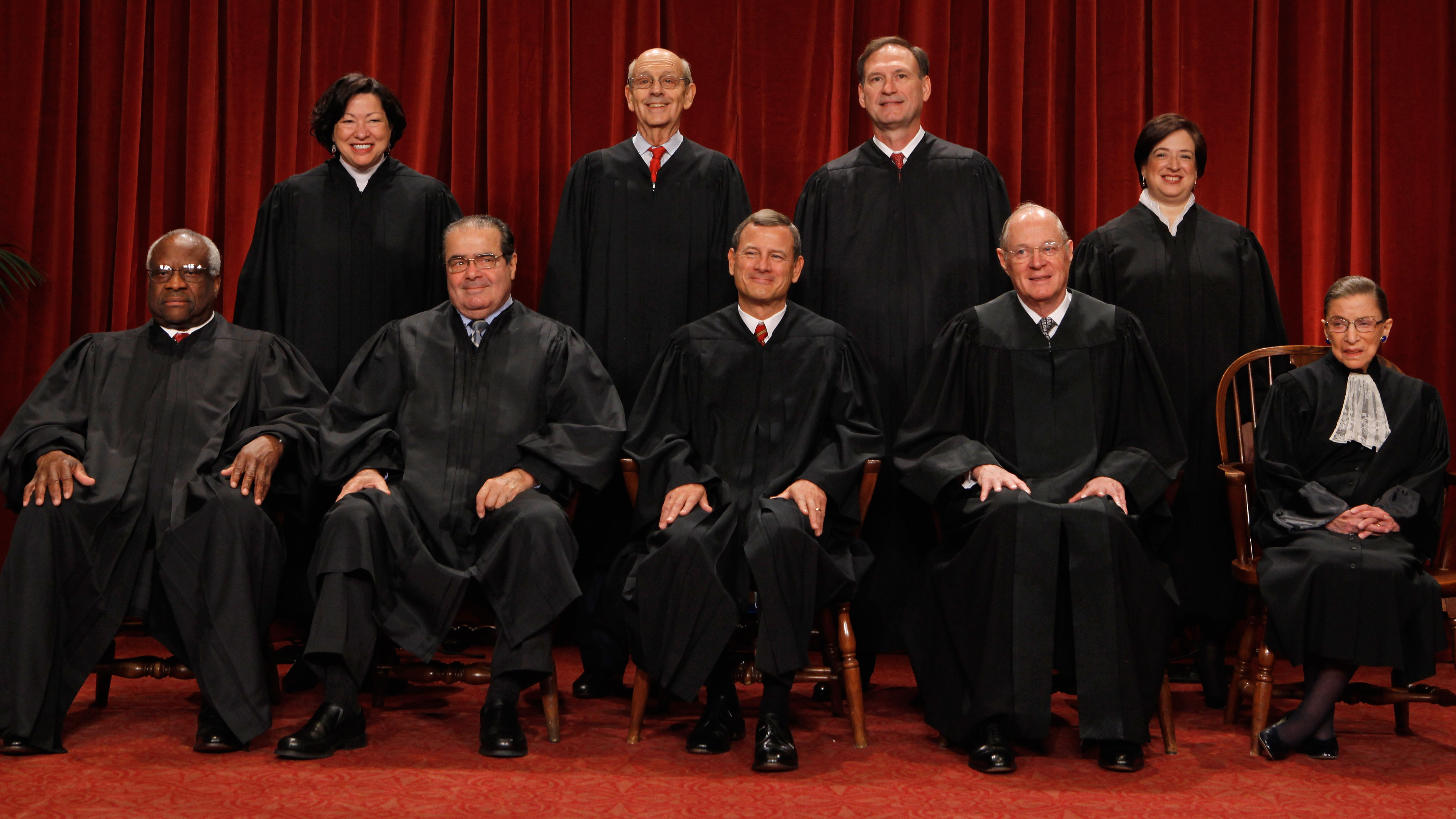 The U.S. Supreme Court justices — (first row, from left) Clarence Thomas, Antonin Scalia, Chief Justice John Roberts, Anthony Kennedy, Ruth Bader Ginsburg, (back row) Sonia Sotomayor, Stephen Breyer, Samuel Alito and Elena Kagan — pose at the Supreme Court in 2010. (Image credit: Getty Images)