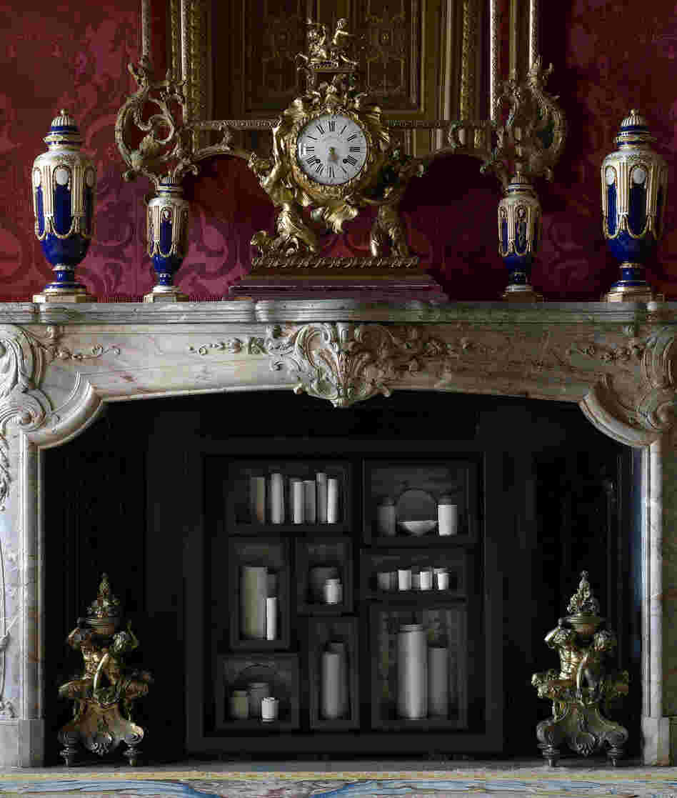 In the Red Drawing Room, de Waal has placed 48 thrown porcelain vessels, jars and dishes in the hearth for his work the properties of fire.