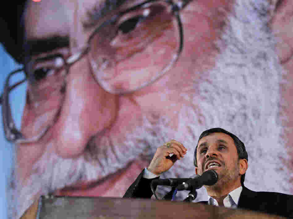 Iranian President Mahmoud Ahmadinejad, shown speaking June 2 under a portrait of Iran's supreme leader, Ayatollah Ali Khamenei, has said Iran will not bow to sanctions.