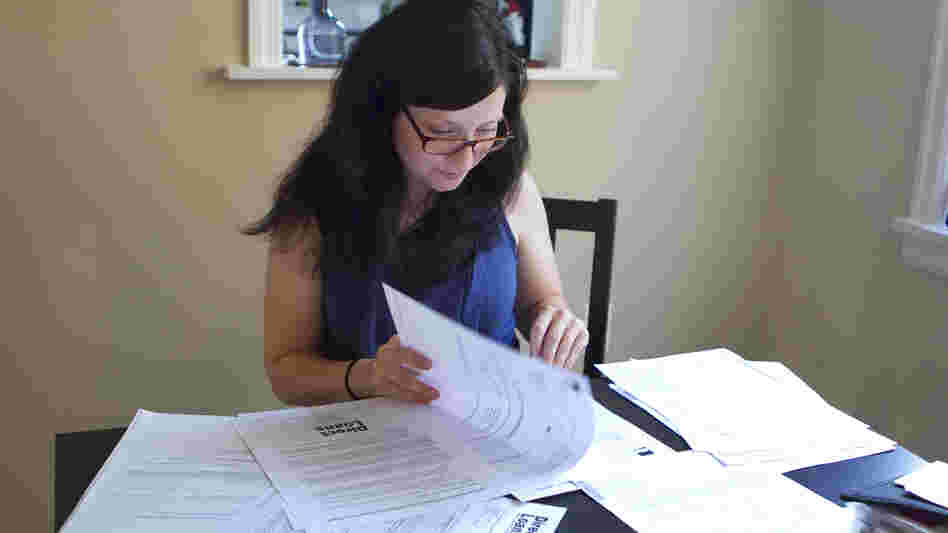 Michelle Holshue racked up $140,000 in student loan debt while training to become a public health nurse. She's living her dream of helping others, she says, but never expected it "to be so hard."