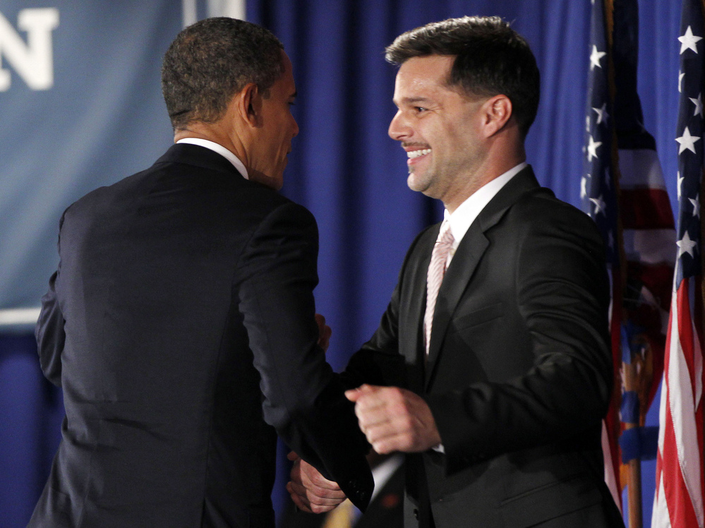 President Obama is introduced by singer Ricky Martin at a fundraiser hosted by Martin and the LGBT Leadership Council at the Rubin Museum of Art on May 14 in New York.