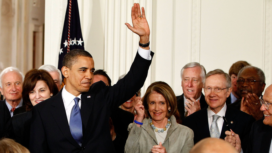 President Obama waves after signing the Affordable Care Act at the White House on March 23, 2010.