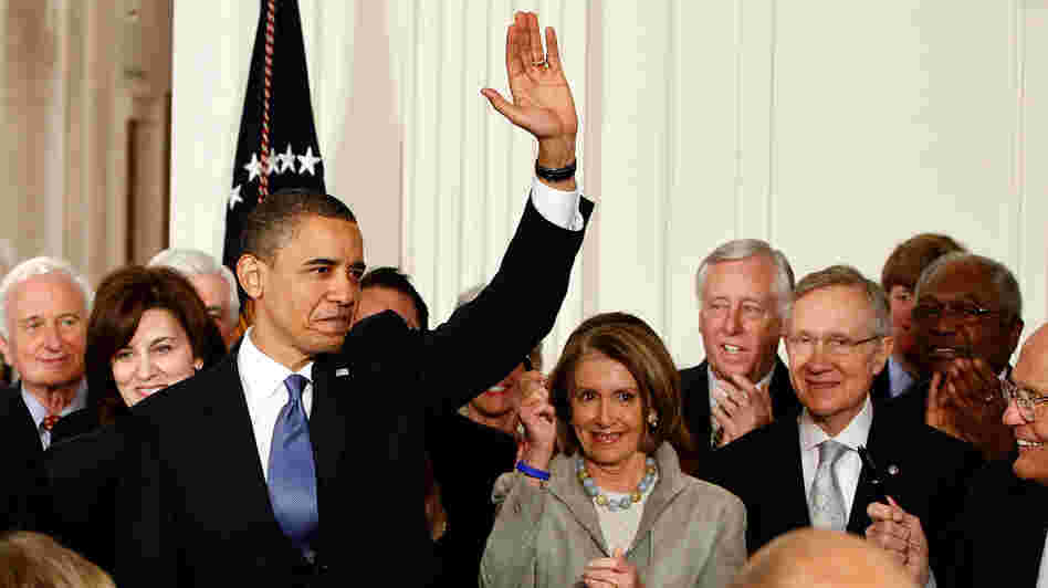 President Obama waves after signing the Affordable Care Act at the White House on March 23, 2010.